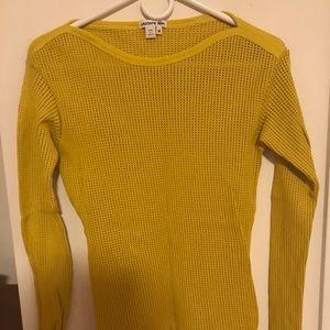 A yellow Lacoste shirt